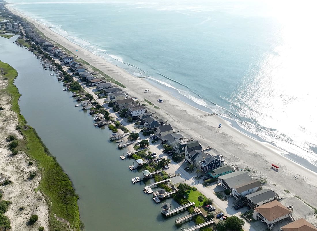 Pawleys Island, SC - Aerial View of Homes with Docks in the Backyard on Pawleys Island in South Carolina in the Early Morning